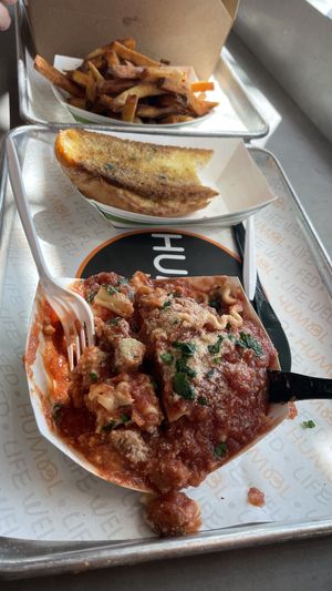Lasagna and garlic bread at HUMBL in Orlando