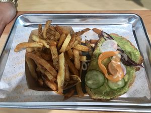 Avocado toast and a side of regular fries at HUMBL in Orlando