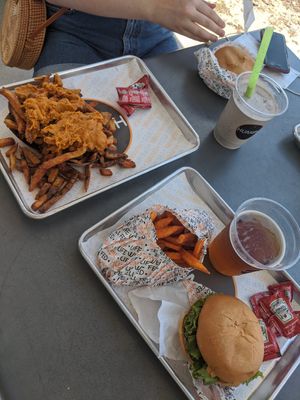 Sweet potato fries with a hamburger and beer on tap. Friend's plate was loaded fries (i forget the menu names) at HUMBL in Orlando