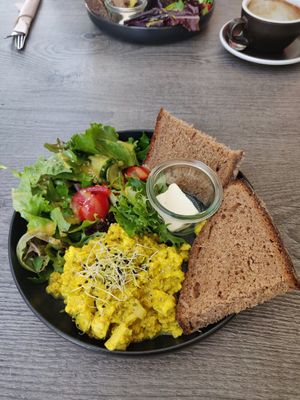 Scrambled eggs I think made from tofu, a nice fresh salad with a vegan honey mustard dressing and sourdough bread I believe at Liebling Trier in Trier