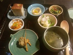 assortment of small dishes, including focaccia, hummus and potato salad at Hale in Kyoto