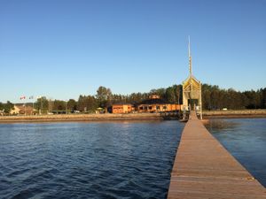 The bistro is on the left where you see the green parasol. Took this picture from the end of a long dock just in front. at Bistro Pointe Taylor in New Richmond