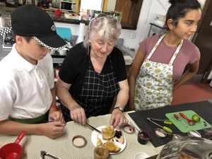 Louise showing her home made jams to Mathis (employee) and Keshani (manager). at Bistro Pointe Taylor in New Richmond