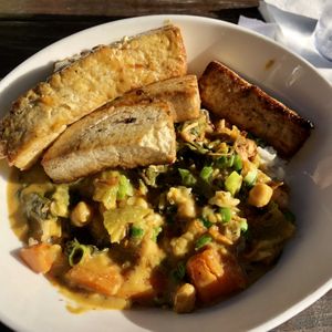 Indian curry veggies rice with sautéed tofu 👍🏼 at Wicked Bao in Fernandina Beach