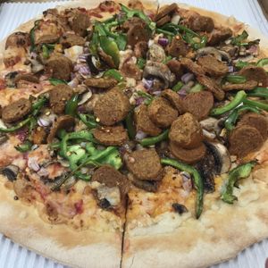 Beyond sausage, bell peppers, onions, mushrooms, and Follow Your Heart cheese at Pizzeria 1081 & Bakery in Akron