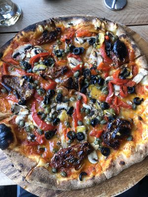 Veggie pizza with vegan cheese at Scoozi in Picton