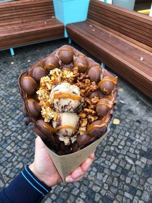 Crispy & crunchy bubble waffle (yes, all vegan!). Hazelnut Praliné Ice cream, topped with almond crunch & caramelized walnuts and warm Caramel sauce with our chocolate dough. at Katchi Ice Cream - Savignyplatz in Berlin