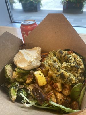 Build your own bowl - daal, grains, greens, roasted sprouts & zucchini, hummus and sweet potatoes. Enough left overs for dinner 😛  at Whole Foods Market - Stonewall St in Charlotte