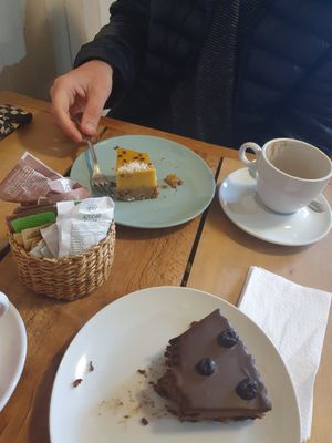 Vegan passionfruit cheesecake and vegan chocolate blueberry torte at Magnolia Cafe Y Pasteleria in Castro