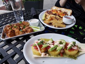 Cauliflower, corn cakes, chopped cheese with fries. All yummy. at Life on Mars in Seattle
