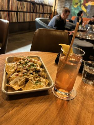 Nachos & a drink 🥃   at Life on Mars in Seattle
