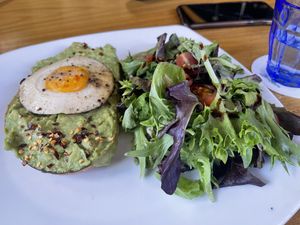 Avocado with sunny side up egg at Life on Mars in Seattle