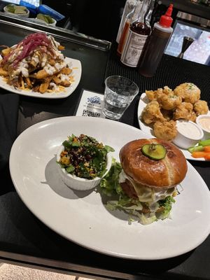 Disco fries, fiery chick’n sandwich, garlic butter parmasean wings   at Life on Mars in Seattle