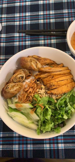 Noodle dish with fake chicken and spring rolls  at Sen Vegan House in Ho Chi Minh City