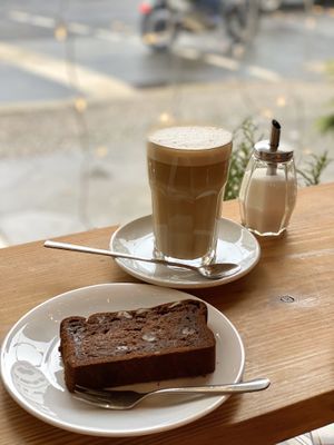 Banana bread and coffee with oat milk at Miros Cafe in Berlin