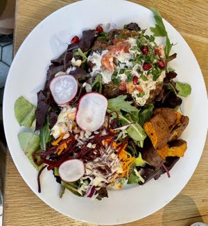 Tahini burger on green  at Kupfert & Kim - Yorkville in Toronto