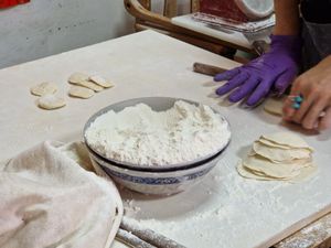 Skins being rolled flat. at Lái Xīn SùShí 來欣素食手工水餃 in Taipei