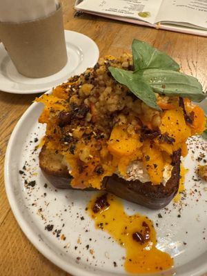 Brioche, smoked hummus, pumpkin, tempeh, chili oil, thai basil, cilantro, furikake  at BarStudio in Warsaw