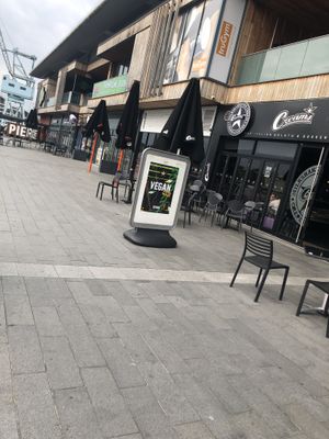 Vegan sign exterior and outside seating  at Creams Cafe in Chatham