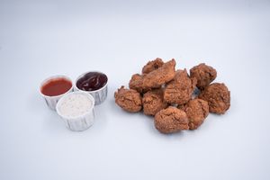 CHKN BITES WITH A CHOICE OF BUFFALO HOT SAUCE, GARLIC MAYO OR BBQ SAUCE at The Green Grill - Hackney Wick in East London