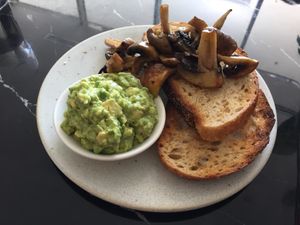 Toast with smashed avocado and mushrooms  at Wollemi in Canberra