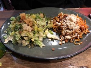 Caesar salad and bolognese pasta combo plate at Don Vegan in Quebec