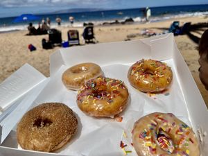 Maple, strawberry with sprinkles and maple churro. All amazing but the churro is the best!! at Maui Ono Donuts in Kihei
