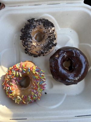 Vanilla with Oreo, plain chocolate, maple with sprinkles  at Maui Ono Donuts in Kihei