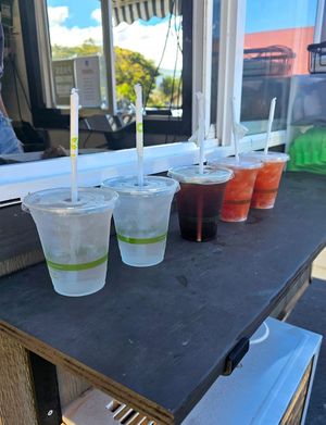 Water, iced coffee, coco h20 with strawberry fizz added at Maui Ono Donuts in Kihei