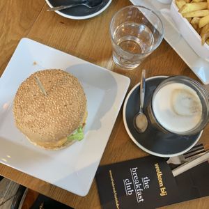 Vegan breakfast burger and macchiato latte  at The Breakfast Club - Sloterdijk in Amsterdam
