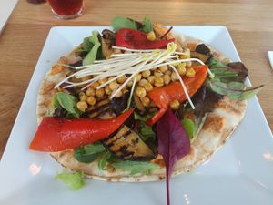 Vegan Lebanese flatbread with hummus at The Breakfast Club - Sloterdijk in Amsterdam