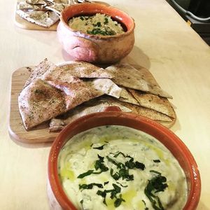 Vegan tzatziki, babaganush served with whole-grain arabic pita-breads at Pernera, Patmos at Pernera in Patmos