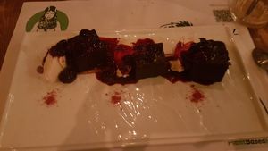 Gluten free vegan brownies with red fruits coulis and creamy ice cream at Pandora Greenbox in Split