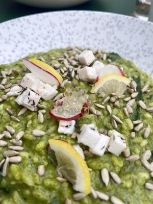 Vegan risotto with vegan feta, vinegar bubbles, seeds, radish and lemons.  at Pandora Greenbox in Split