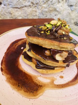 Chocolate banana pistachio and peanut butter vegan pancakes. Vegan sliders with beetroot buns. Mimosas with decorative dried flowers.  at Pandora Greenbox in Split