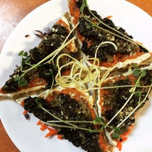 Raw Vegan Pizza with Mushroom Topping on Almond Bread at Green Wave Cafe in Plantation