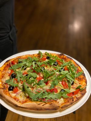 Verdure pizza- artichoke, red onion, peppers, olives and rocket with vegan cheese at Milan in Wooler