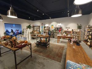 Eco shop and further seating through archway at Open House Deli in Winchester