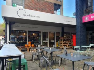 Outdoor seating and seasonal produce at Open House Deli in Winchester