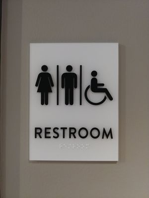 Restroom sign at honeygrow in Reston
