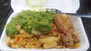 Vegan sausage, chips, mushy peas and scraps at Laura's Fish Bar in Whitley Bay