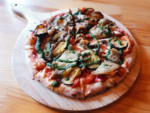 Their vegan pizza with vegan pesto and added vegan cheese. Yummy 😋 at DogTown Lagos in Lagos