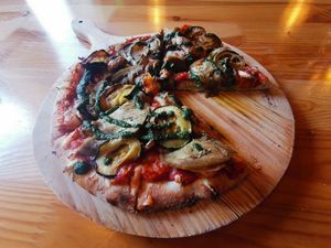 Their vegan pizza with vegan pesto and added vegan cheese. Yummy 😋 at DogTown Lagos in Lagos