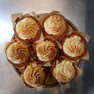 Festive, Vegan carrot cake muffins, topped with a cinnamon and ginger "butter icing" at The Lift Up in Manchester