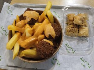Falafel Fries Basket: Fries and falafel w/ vegan chilli garlic mayo, Vegan Baklawa at Umi Falafel - North City in Dublin
