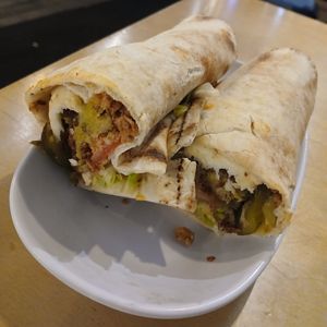 Spicy Harissa Wrap: wrap full of falafel, harissa mayo, tomatoes, lettuce, crispy onions, & pickles at Umi Falafel - North City in Dublin
