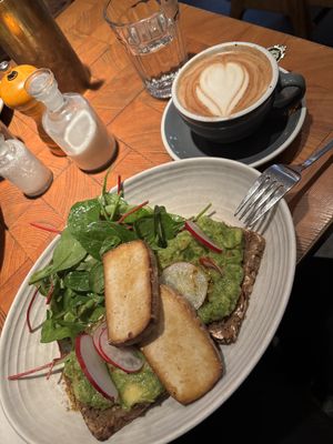 Avocado toast and tofu with an oat milk cappuccino   at ERICH in Vienna