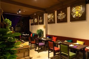 offering jewels pictures are respectedly hung on the old French-style wall at Shamballa Vegetarian Restaurant & Tea House in Ho Chi Minh City