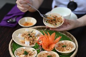 Vietnamese Steamed Cakes topped with peanuts and fried onions and served with House sauce. at Shamballa Vegetarian Restaurant & Tea House in Ho Chi Minh City
