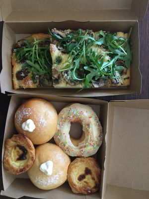 Focaccia funghi, crema bombo, pastel de nata and donut at Life's a Peach in Utrecht